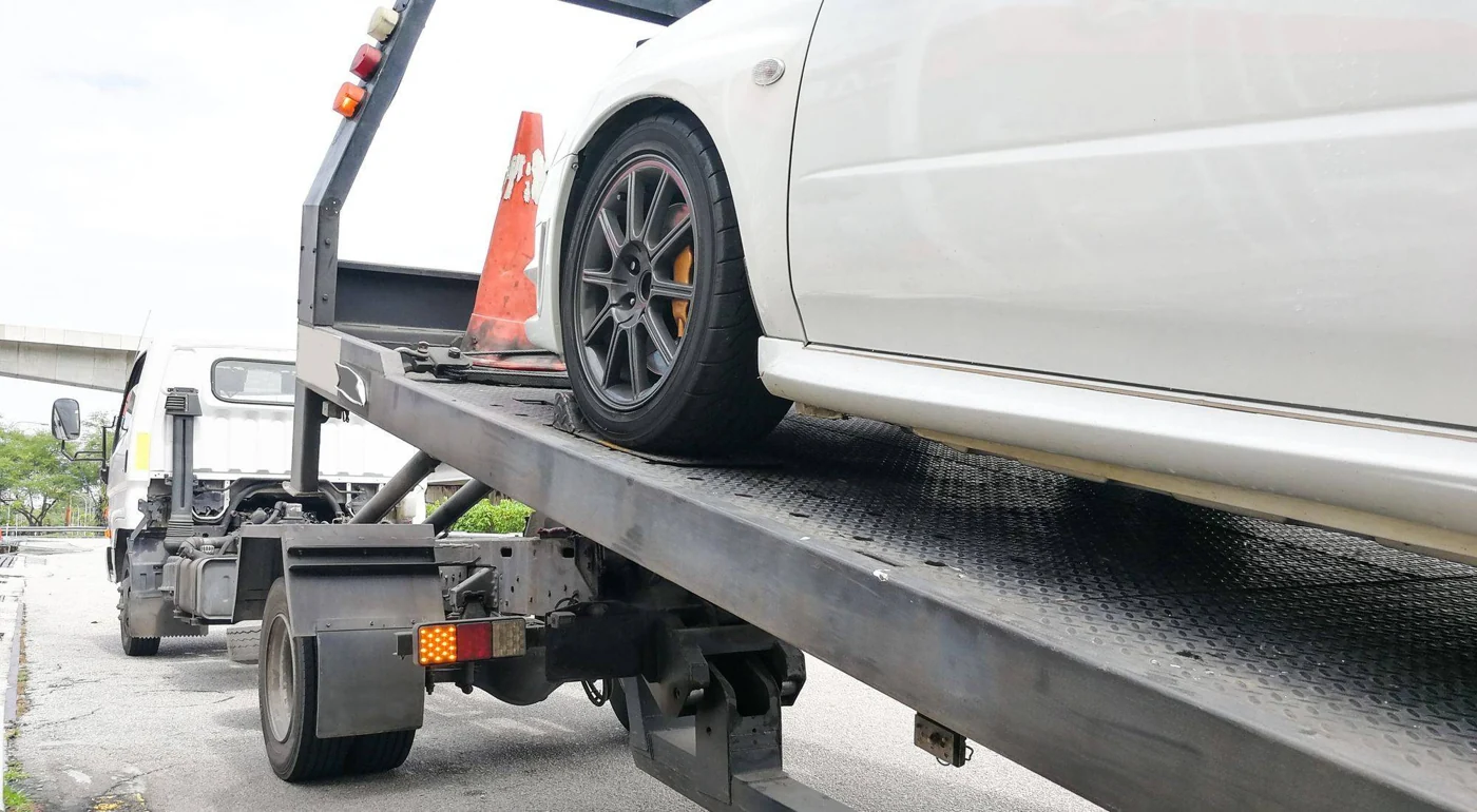 Detail of a vehicle on a flatbed tow truck