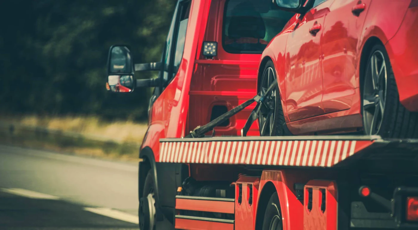Vehicle secured on a flatbed transporter